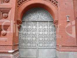 old red brick building with sectile gate