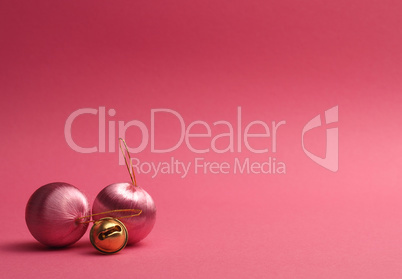 Pink vintage Christmas baubles on a pink background