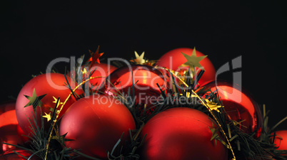 Red Christmas balls on a black background