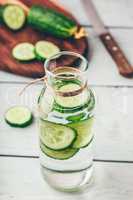 Infusion with sliced cucumber in bottle