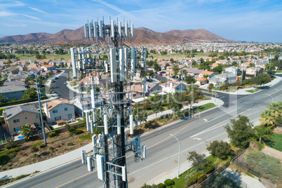 Close-up Aerial of Cellular Wireless Mobile Data Tower with Neig