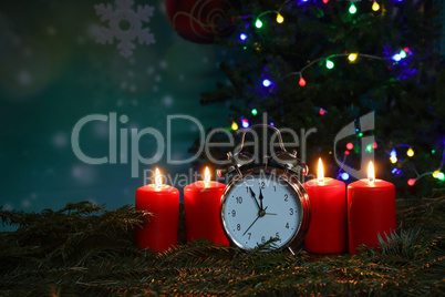 New year composition with alarm clock and burning candles