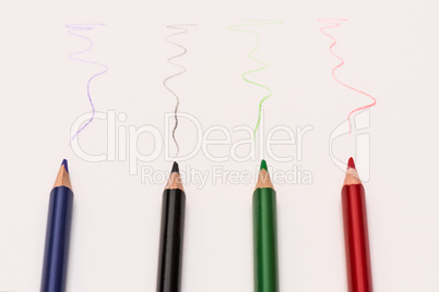 Colour pencils lay on white background