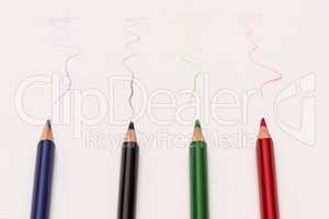 Colour pencils lay on white background