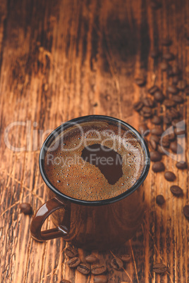 Brewed black coffee in metal mug
