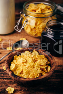 Breakfast with corn flakes, milk and jam