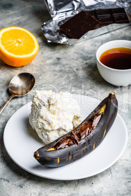 Grilled banana with dark chocolate and vanilla ice cream.