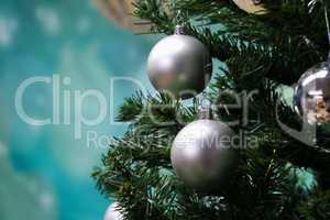 Silver balls hang on the Christmas tree