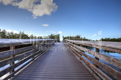 Boardwalk leading to Lovers Key State Park on a sunny day in For
