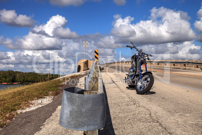 Motorcycle along the side of a highway bridge of Bonita Beach ca