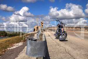 Motorcycle along the side of a highway bridge of Bonita Beach ca