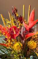 Tropical bouquet of flowers including Heliconia bihai, yellow on