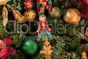 Nutcracker ornament hanging on a Christmas tree