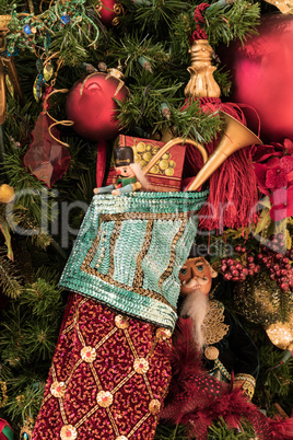 Christmas stocking hangs on a Christmas tree