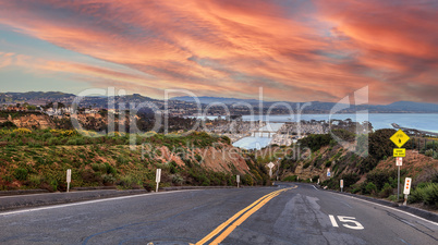 Sunset over Road leading down to Dana Point Harbor