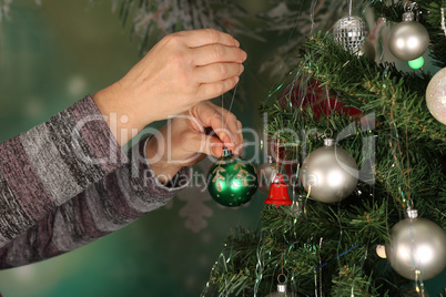 Beautiful bright balls are hung on the Christmas tree