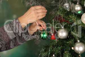 Beautiful bright balls are hung on the Christmas tree