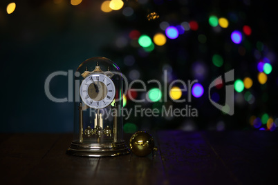 Christmas composition with clock and beautiful bokeh in the background