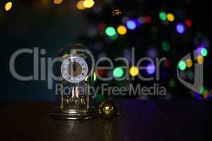 Christmas composition with clock and beautiful bokeh in the background