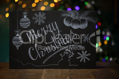 Merry Christmas. Composition with a black chalkboard on the table.