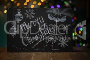 Merry Christmas. Composition with a black chalkboard on the table.