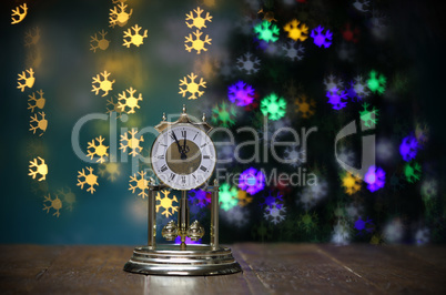 Christmas composition with clock and beautiful bokeh in the background