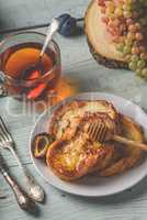 French toasts with honey, fruits and tea