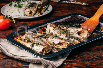 Baked fish carcasses on baking sheet