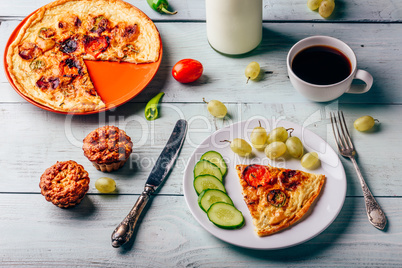 Healthy breakfast with frittata, cup of coffee and muffins.