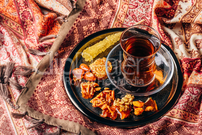 Tea in armudu with oriental delights and crystal sugar