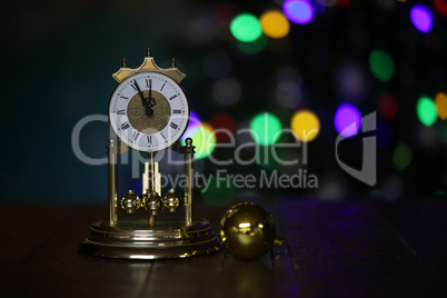 Christmas composition with clock and beautiful bokeh in the background