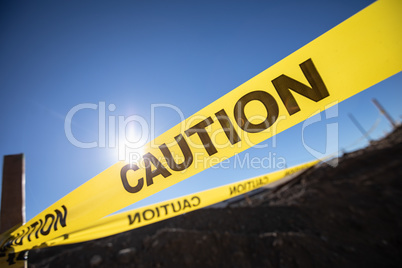 Yellow Caution Tape Posted Around Dangerous Area Outside