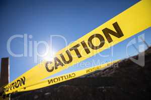 Yellow Caution Tape Posted Around Dangerous Area Outside