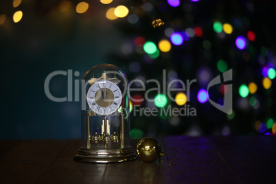 Christmas composition with clock and beautiful bokeh in the background