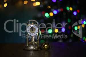 Christmas composition with clock and beautiful bokeh in the background