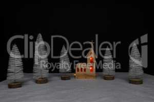 Landscape with a small church made of plywood on Christmas night