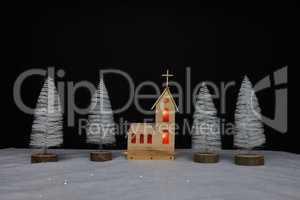 Landscape with a small church made of plywood on Christmas night