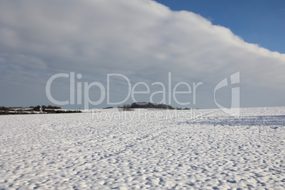 Snow-covered fields on a clear winter day