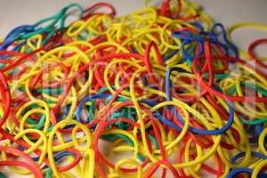 Multi-colored elastic band rubber scattered on the table