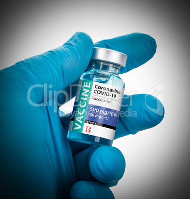 Doctor or Nurse Wearing Surgical Glove Holding Coronavirus COVID