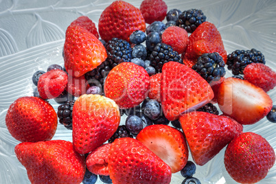 Mixed berry background that includes red strawberries