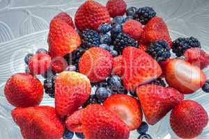 Mixed berry background that includes red strawberries
