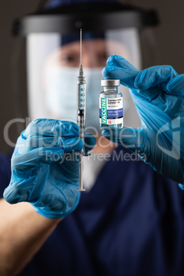 Doctor or Nurse Wearing Surgical Gloves Holding Vaccine Vial and