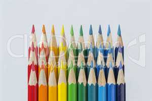 Three rows of colored pencils against a white background.