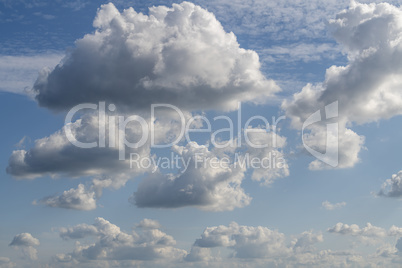 Blue sky with white clouds as a background photo.