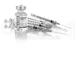 Coronavirus COVID-19 Vaccine Vial and Several Syringes On Reflec