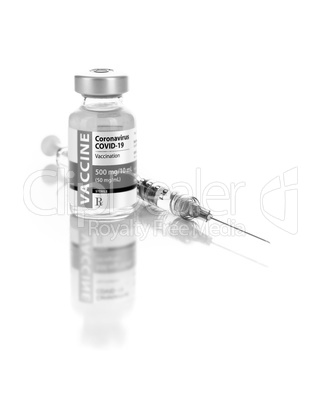 Coronavirus COVID-19 Vaccine Vial and Syringe On Reflective Whit