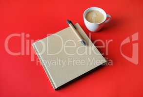Book, coffee cup, pen