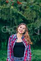 Smiling woman standing in the park