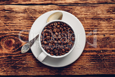 Cup full of roasted coffee beans